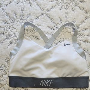 Nike jog bra in Large, but fits like a medium.